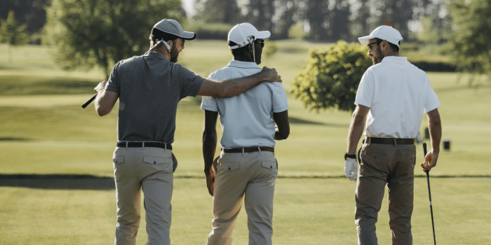 Three Men Are Enjoying A Round Of Golf.
