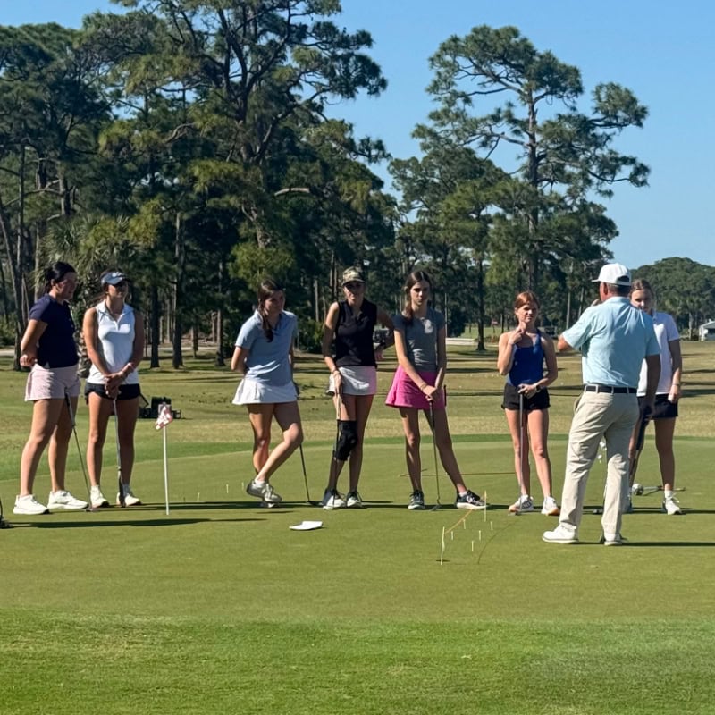 Young female golf team