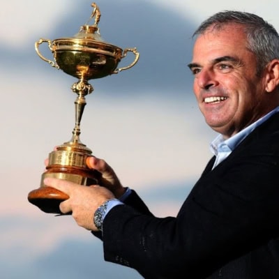 Happy man holding trophy