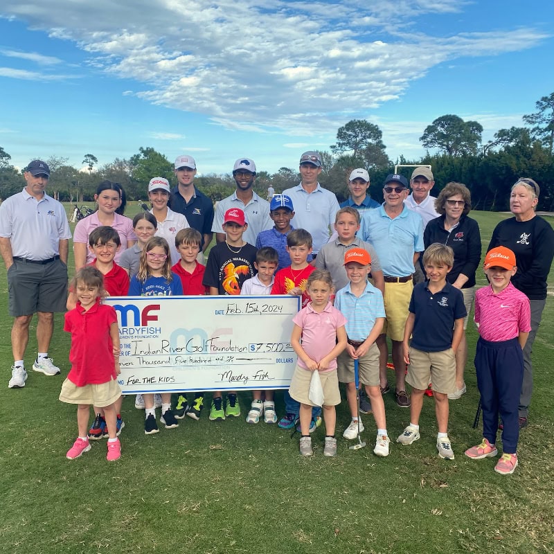 Group photo with oversized donation check