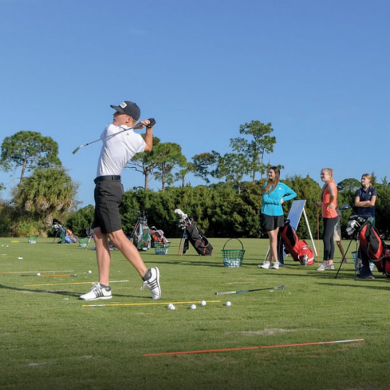 Teen golfer driving the ball
