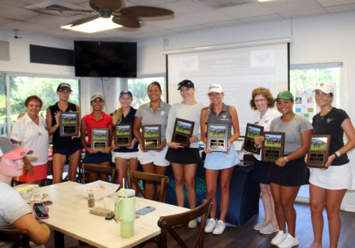 Yound women holding trophys