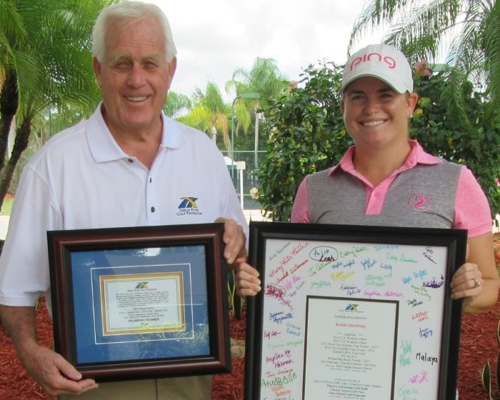 Female Golfer Receiving Award.